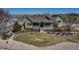 Charming home showcasing a well-manicured lawn and inviting front porch, perfect for relaxing outdoors at 3545 Cottonwood Cir, Longmont, CO 80504