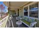 Relaxing front porch featuring comfortable seating and tranquil views, perfect for enjoying the outdoors at 3545 Cottonwood Cir, Longmont, CO 80504