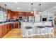 Spacious kitchen with cherry cabinets, stainless steel appliances, and breakfast bar with seating at 3545 Cottonwood Cir, Longmont, CO 80504
