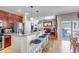 Kitchen with breakfast bar overlooks living area with hardwood floors at 3545 Cottonwood Cir, Longmont, CO 80504