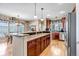 Modern kitchen with granite countertops, stainless steel appliances, and a spacious island, perfect for entertaining at 3545 Cottonwood Cir, Longmont, CO 80504