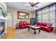 Cozy living room features hardwood floors, a fireplace, and ample natural light, enhancing the inviting atmosphere at 3545 Cottonwood Cir, Longmont, CO 80504