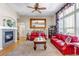 Bright living room with a fireplace and large window, creating a comfortable and inviting space at 3545 Cottonwood Cir, Longmont, CO 80504