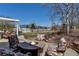 Outdoor patio with a fire pit and comfortable seating, perfect for entertaining at 3545 Cottonwood Cir, Longmont, CO 80504