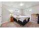 Comfortable bedroom showcasing a plush bed and complementary decor, inviting a relaxed atmosphere at 8736 W 46Th Ave, Wheat Ridge, CO 80033