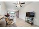 This airy living area has a brick wall accent and leads to an adjacent dining space at 8736 W 46Th Ave, Wheat Ridge, CO 80033