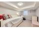 Minimalist bedroom boasting carpet, a white bed frame, and a cozy reading nook at 1000 N Monaco Pkwy, Denver, CO 80220