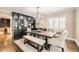Elegant dining room featuring a modern chandelier and hutch with dining table, perfect for hosting dinner parties at 1000 N Monaco Pkwy, Denver, CO 80220
