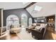 Open-concept living room with vaulted ceilings, skylights and multiple seating areas perfect for entertaining at 1000 N Monaco Pkwy, Denver, CO 80220