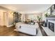 Bright living room featuring a fireplace, built-in bookshelf, and comfortable seating creating an inviting and functional space at 1000 N Monaco Pkwy, Denver, CO 80220
