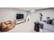 Finished basement featuring a tv, a decorative teepee, and a comfy beanbag at 1000 N Monaco Pkwy, Denver, CO 80220