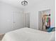 Neutral bedroom with a walk-in closet and ensuite bathroom access with modern finishes at 8475 E 36Th Ave # 131, Denver, CO 80238