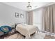 Bedroom featuring neutral walls, with a window, carpet and curtains at 8475 E 36Th Ave # 131, Denver, CO 80238