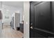 Modern entrance featuring a sleek door, contemporary decor, and hardwood flooring at 8475 E 36Th Ave # 131, Denver, CO 80238