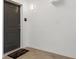 Clean entryway featuring a welcome mat and a neutral color palette for a modern, inviting space at 8475 E 36Th Ave # 131, Denver, CO 80238