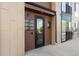 Modern building exterior with multiple units, visible unit numbers, and easy access entrance at 8475 E 36Th Ave # 131, Denver, CO 80238