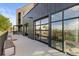 Modern exterior showcasing a patio with benches and large glass garage doors for indoor/outdoor living at 8475 E 36Th Ave # 131, Denver, CO 80238