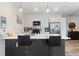 Bright kitchen featuring a spacious island, modern appliances, and sleek countertops at 8475 E 36Th Ave # 131, Denver, CO 80238