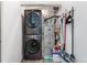 Laundry room with a full-size washer and dryer and additional storage shelves at 8475 E 36Th Ave # 131, Denver, CO 80238