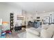 Open-concept living room features a kitchen, hardwood floors, and an open floor plan at 8475 E 36Th Ave # 131, Denver, CO 80238