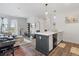 Open concept living area featuring modern decor, hardwood floors, and ample natural light at 8475 E 36Th Ave # 131, Denver, CO 80238