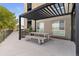 Outdoor patio area featuring a pergola, picnic table, and grill, perfect for outdoor dining at 8475 E 36Th Ave # 131, Denver, CO 80238