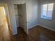 Bright bedroom with hardwood floors, closet, and natural light from the window at 3540 Niagara St, Denver, CO 80207