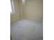 Cozy bedroom with natural light from the window and neutral walls and flooring at 3540 Niagara St, Denver, CO 80207
