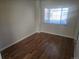This bedroom boasts hardwood floors and a window, providing natural light and a cozy atmosphere at 3540 Niagara St, Denver, CO 80207