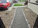 A gravel walkway lined with river rock leads to the front door of this home at 3540 Niagara St, Denver, CO 80207