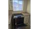 Stainless steel range and oven beneath a kitchen window at 3540 Niagara St, Denver, CO 80207