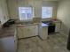 This kitchen features stainless appliances, ample countertop space, and bright natural light at 3540 Niagara St, Denver, CO 80207