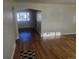 Bright living room featuring newly refinished hardwood floors and fresh paint at 3540 Niagara St, Denver, CO 80207