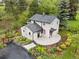 Aerial view of house showing landscaping and patio at 5071 Parmalee Gulch Rd, Indian Hills, CO 80454