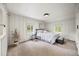 Inviting bedroom with two windows, paneled walls, and a comfortable queen-sized bed at 5071 Parmalee Gulch Rd, Indian Hills, CO 80454