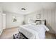 Bedroom featuring paneled walls and a comfortable queen-sized bed with natural lighting at 5071 Parmalee Gulch Rd, Indian Hills, CO 80454