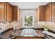 Kitchen with granite countertops and cabinetry, providing great storage and workspace at 5071 Parmalee Gulch Rd, Indian Hills, CO 80454
