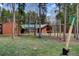 Exterior shows a large backyard with mature trees and a playset at 9123 Booker Ln, Conifer, CO 80433