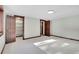 Spacious bedroom showcasing natural light, a closet, and wood trim at 9123 Booker Ln, Conifer, CO 80433