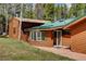 Exterior showing wood siding, large windows, and a stone facade at 9123 Booker Ln, Conifer, CO 80433