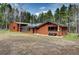 The exterior shows a well-maintained lawn and mature trees at 9123 Booker Ln, Conifer, CO 80433