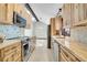 Open kitchen features butcher block countertops, stainless appliances and natural light at 9123 Booker Ln, Conifer, CO 80433