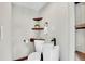 Modern powder room with a unique vessel sink, floating shelves, and stylish fixtures at 9123 Booker Ln, Conifer, CO 80433