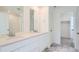Bathroom featuring double sinks, granite countertops, and a separate toilet room at 2088 S Haleyville Way, Aurora, CO 80018