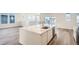 Open kitchen and dining area featuring an island, stainless steel appliances and hardwood floors at 2088 S Haleyville Way, Aurora, CO 80018