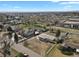 Expansive aerial view showcasing the property and its surroundings in a neighborhood setting at 9950 W 17Th Ave, Lakewood, CO 80215
