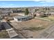 Discover this property with a spacious lot and convenient neighborhood access, captured in stunning aerial view at 9950 W 17Th Ave, Lakewood, CO 80215