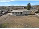 Birds eye view of a single story home with neutral siding and a spacious, unfinished backyard at 9950 W 17Th Ave, Lakewood, CO 80215