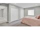 Neutral bedroom with plush carpet, ample closet space, and bright, natural light at 9950 W 17Th Ave, Lakewood, CO 80215