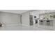 Open-concept kitchen features stainless steel appliances and breakfast bar seating at 9950 W 17Th Ave, Lakewood, CO 80215
